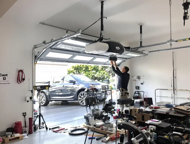 Canton Garage Door Repair specialist installing smart garage door opener system in Canton home